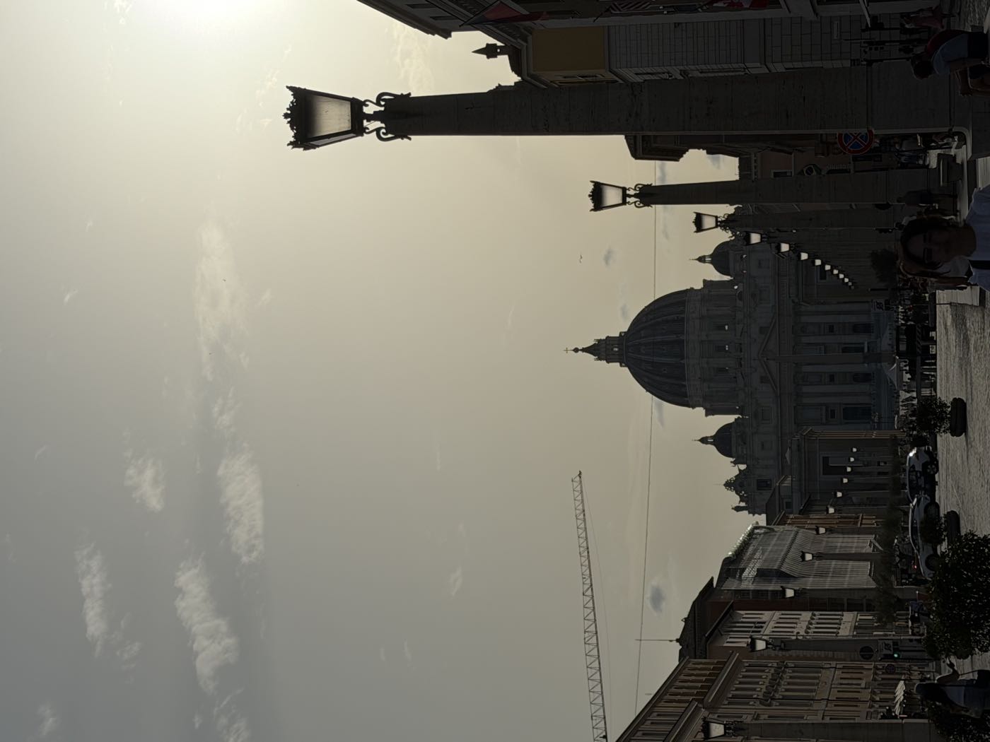 St Peter's dome backlit from Via della Conciliazione at golden hour